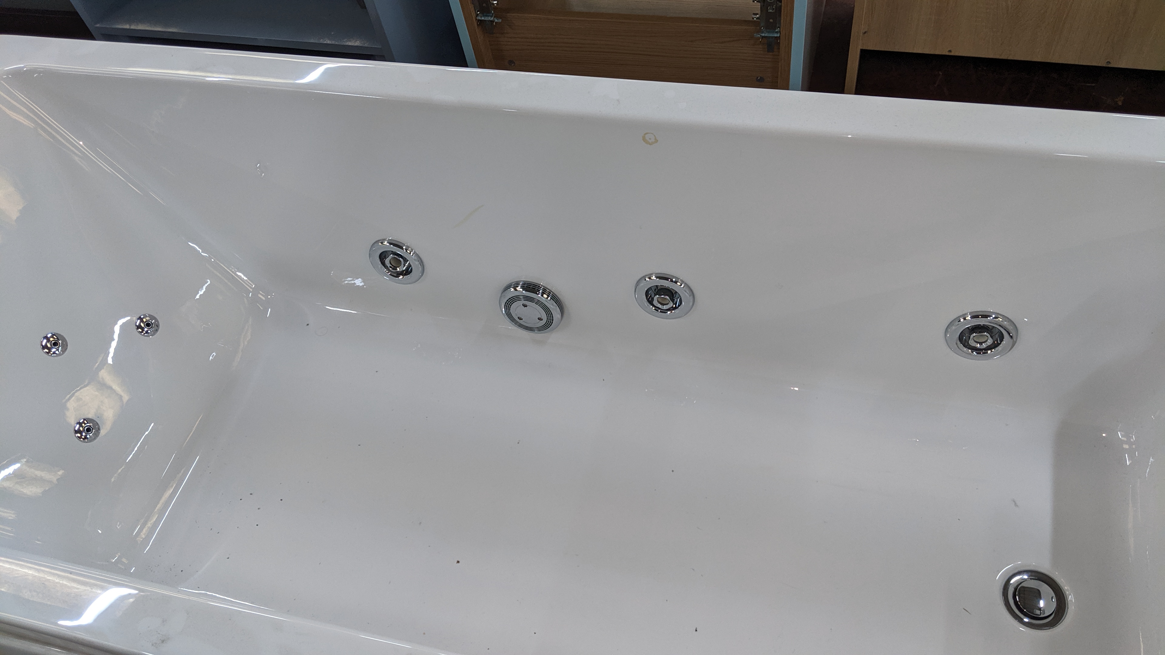 Bath tub with jacuzzi jet inserts plus mixer taps. This is one of a