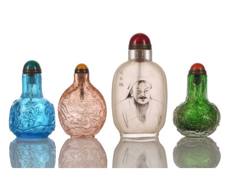 A collection of Chinese carved glass snuff bottles and stoppers. Together with a larger internally painted glass snuff flask 