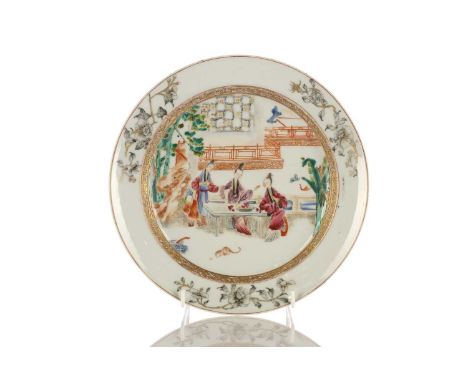 A Chinese Famille rose plate, Qing, mid 18th century, painted with two females seated at a table with a bowl of finger citron
