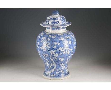 A Chinese blue &amp; white vase and cover, Qing, Kangxi, the cover with pointed knop and painted with lotus flower scrolls wi