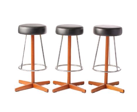 A set of three Dyrlund Smith of Denmark "Mid-Century Vintage" teak breakfast bar stools with circular black vinyl seats and s