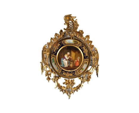 A Continental hand painted cabinet plate in a gilt bronze rococo surround. The sole of the plate entitled "l’écureuil" (The S