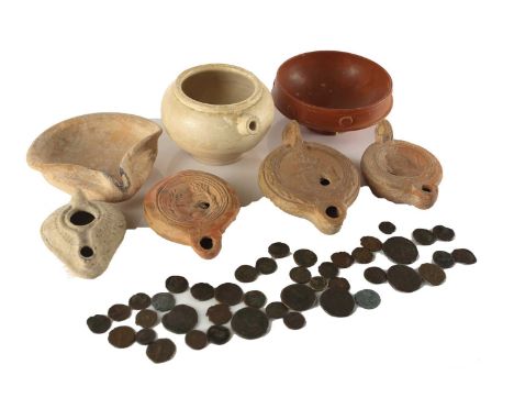 A collection of Roman and other antique oil lamps and pottery, to include a Tunisian red pottery oil lamp, circa 2 AD, with m