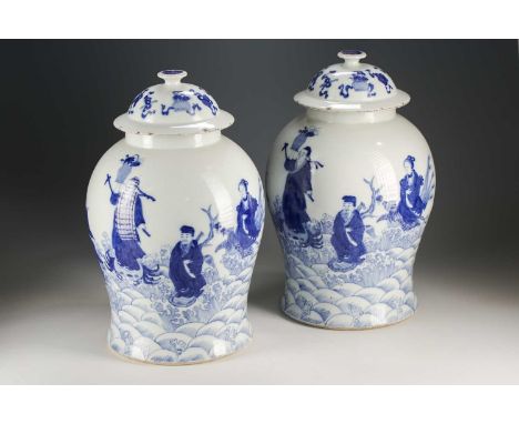 A pair of Chinese blue and white vases and covers, Qing, late 19th century, painted with the eight Taoist immortals above spu