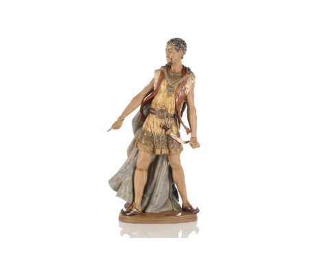A scarce Lladro large figure of a Moor, wearing a hooded blue cloak, a dagger on his hip, on an oval base, 46 cm highConditio