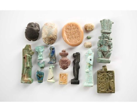A collection of ancient Egyptian antiquities, comprising a faience amulet of Bes, Ptolemaic period, purchased from B A Seaby 