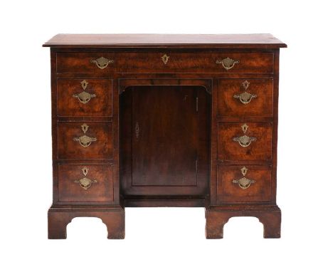 A George I/II style walnut lady's kneehole writing desk with cross and herringbone banded top above a single frieze drawer an