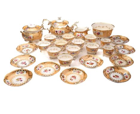 An H&amp;R Daniel porcelain teaset, comprising teapot, covered sucrier, cream jug, slop bowl and ten cups and saucers (with t