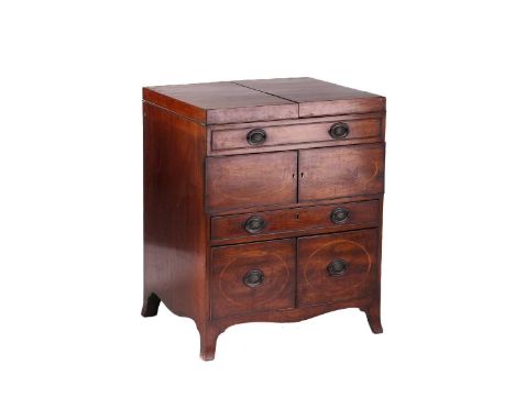 A George III Heppelwhite style satinwood crossbanded mahogany Gentleman's dressing table, the two flap top opening to reveal 