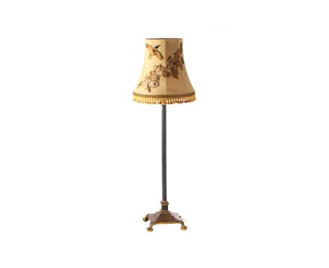 A Victorian iron and brass Corinthian column standard lamp with telescopic action over a stepped architectural base and lion'