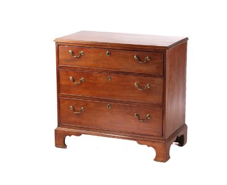 A George III mahogany provincial commode chest of three long drawers, with swan neck handles and supported by shaped bracket 