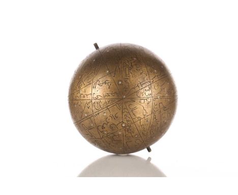 An Indo-Persian style brass celestial globe with engraved Islamic annotation and axial mountings, inset with positions of the