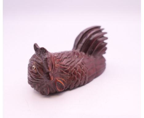 A netsuke in the form of a chicken.  6 cm long.