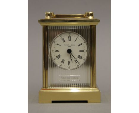 A Taylor &amp; Bligh silver mounted carriage clock. 15 cm high.