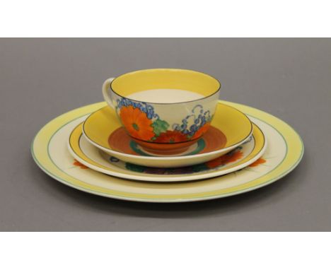 A Clarice Cliff Bizarre Gayday trio and a Clarice Cliff Crocus pattern plate. The latter 23 cm diameter.