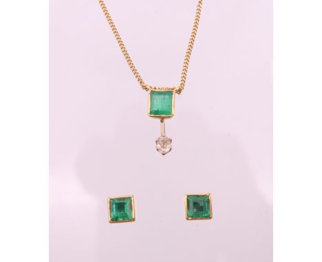 A 9 ct gold, emerald and diamond pendant necklace with matching earrings.  Pendant 1.5 cm high, chain 45 cm long, earrings 0.