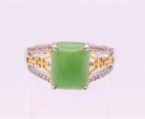 A silver and jade ring. Ring size Q.