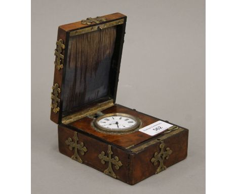 A 19th century brass mounted walnut cased travelling clock. The case 9 cm wide.
