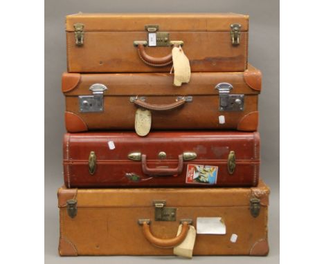 Four vintage suitcases. The largest 66 cm wide.