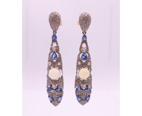 A pair of opal, diamond and sapphire earrings.  5.75 cm high. 