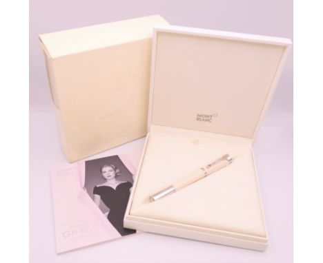 A Montblanc/Mont Blanc Princess Grace de Monaco ivory coloured rollerball pen, boxed with papers.  The pen 13.5 cm long.