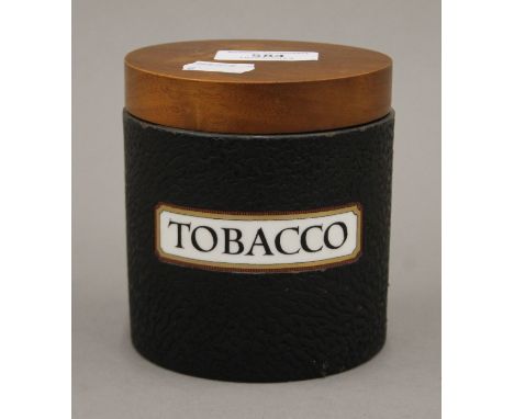 A vintage Dunhill tobacco box. 11 cm high.