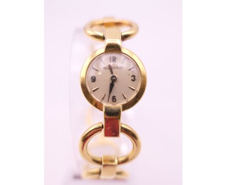 An 18 ct gold Jaeger-LeCoultre ladies wristwatch, inscribed to reverse MMB Argaty  Doune. 34 grammes total weight.