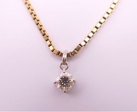 A diamond pendant on a 9 ct gold chain.  Pendant 0.5 cm diameter, chain 40 cm long. 5.6 grammes total weight.