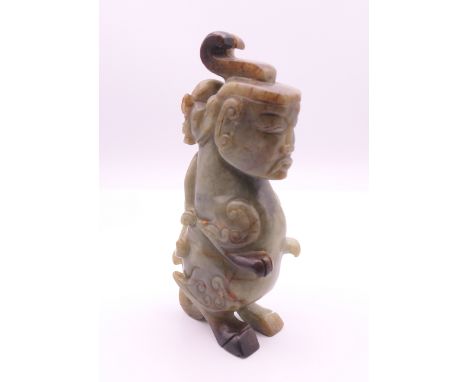 A Chinese jade mythical carving. 15 cm high.