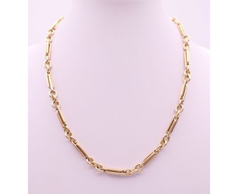 A 9 ct gold watch chain, converted to a necklace.  40.5 cm long. 29.9 grammes.