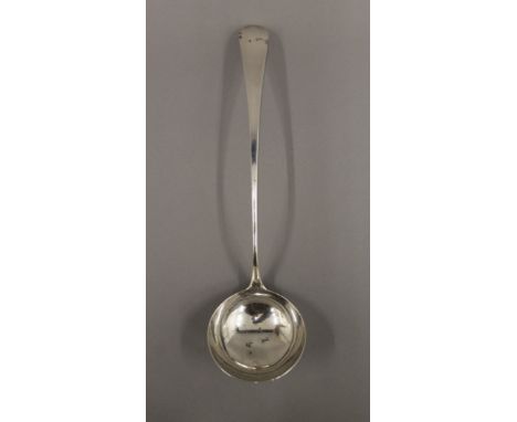 A Georgian silver ladle. 34 cm long. 165.2 grammes.