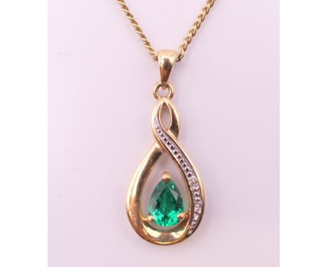 A 9 ct gold pendant on chain.  Pendant 3 cm high including suspension loop, chain 44 cm long. 3.5 grammes total weight.