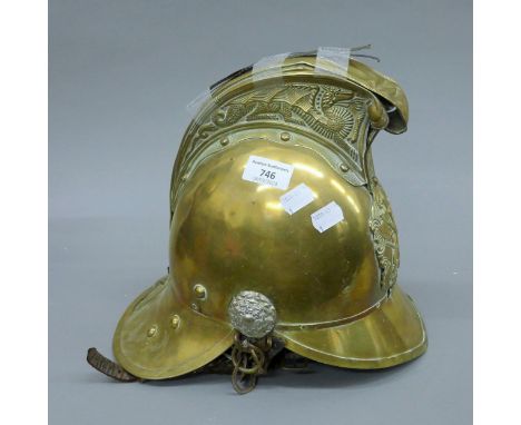 A vintage brass fireman's helmet.