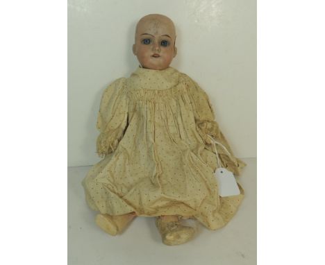 An Armand Marseille bisque socket head doll, impressed 390 4/0 to back of the head, with sleeping blue glass eyes, open mouth