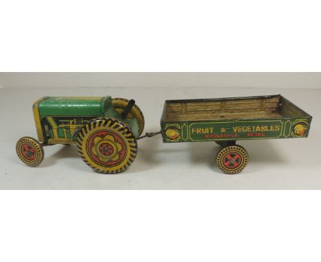 Mettoy clockwork tinplate tractor and trailer "Fruit & Vegetables" with colour printed detail, 29cms long overall ++lacks key