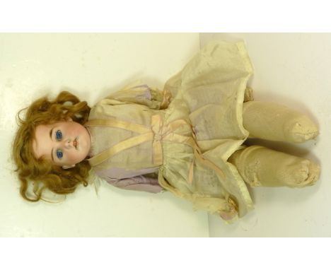 An Armand Marseille bisque shoulder head doll impressed A1776M and with brown wig, sleeping blue glass eyes, open mouth with 