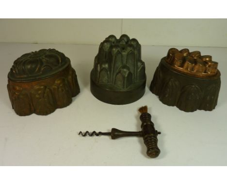 KITCHENALIA - A Victorian copper food mould of typical "turreted" design, two other copper on tin food moulds; a 19th Century