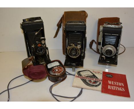 A Zeiss Ikon Nettar folding camera in canvas case; a Coronet Rapide folding camera in case; an Agfa folding camera and a West