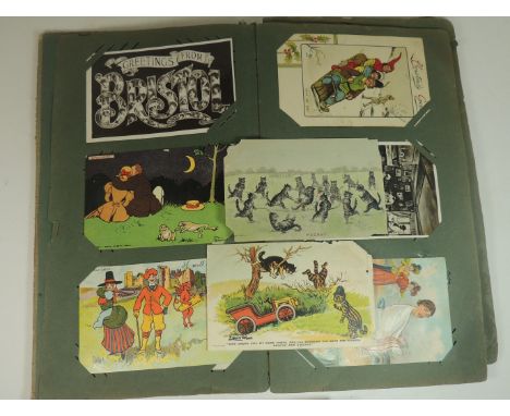 An interesting album of approx 63 assorted early 20th Century postcards including Louis Wain; Tom Browne; photo topo;chromo l