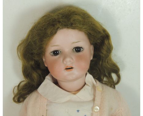 A German bisque socket head doll impressed "1916 7a" to back of head (makers name indistinct above hairline) having sleeping 