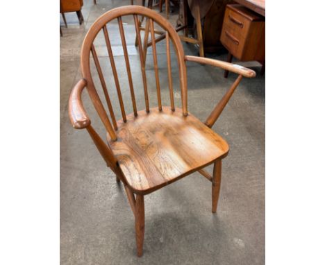 An Ercol elm and beech Windsor elbow chair 