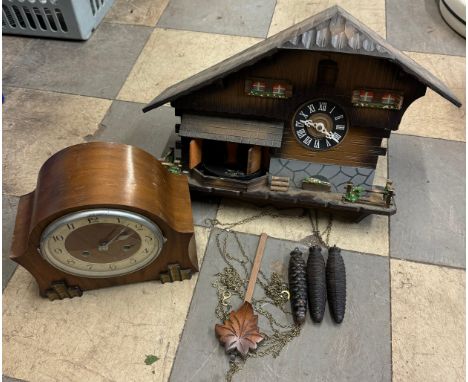 An Art Deco walnut mantel clock and a cuckoo clock 