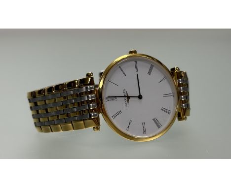 A Longines La Grande Classique gilt metal quartz wristwatch with white enamel dial roman numerals on fitted strap: d. x 3cm 