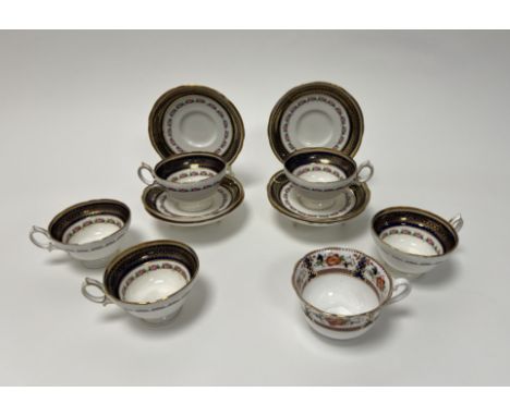 A19thc Hammersley Longton part tea service decorated with gilt edges on cobalt blue with a pink rose border comprising, seven
