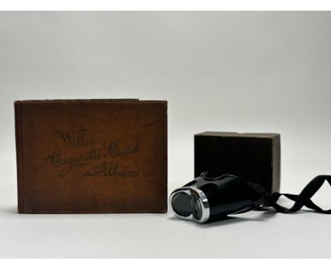 A 1930's Gowlands Berger Loup magnifier head piece together with a Collectors book titled Will's Cigarette Card Album contant