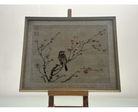A Chinese watercolour on silk of a perched bird on cherry blossom, red seal marked, in a glazed frame (29cmx35cm) together wi