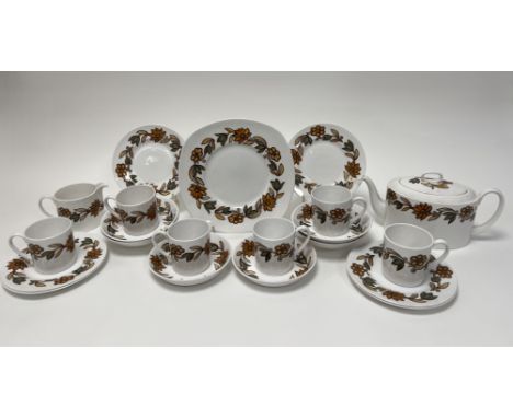 A Susie Cooper tea service decorated with an Art Nouveau pattern of Autumnal leaves and flowers comprising, a square form cak