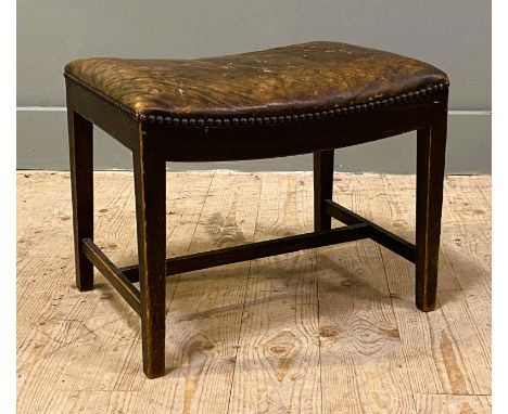 A 19th century oak framed footstool, with brown leather upholstery