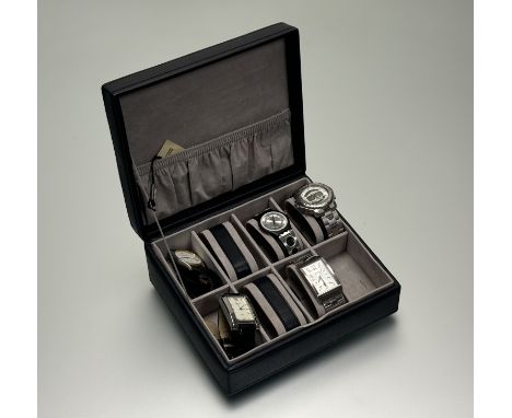 A black wristwatch box for eight watches containing a Boss quartz stainless steel wristwatch, a Swatch quartz wristwatch, a P