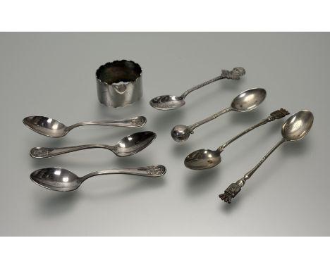 An epns crenellated oval napkin ring, a set of three crested tea spoons and four various souvinier tea spoons (a lot)